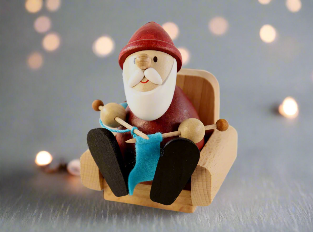 Weihnachtsmann Collectibles - Santa Knitting in Armchair